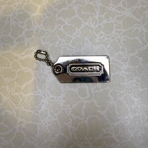 Coach Silver bag tag